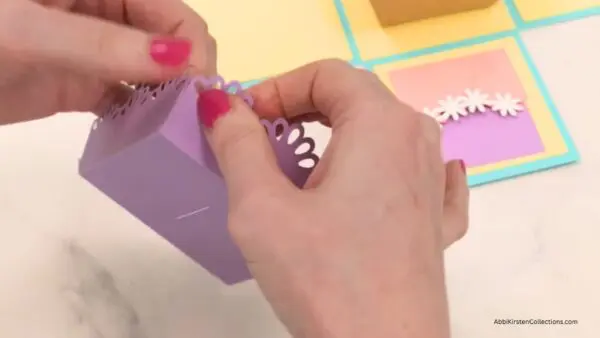 Gluing sides of treat box lid