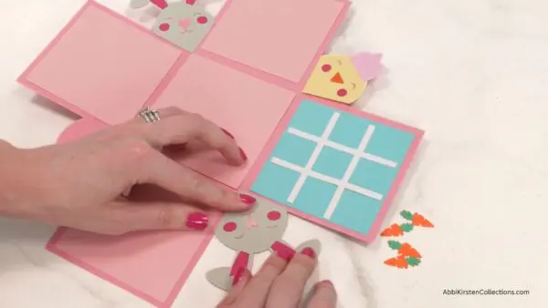 adding tic tac toe and other decorations to explosion box