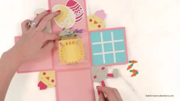 gluing Easter and spring decorations to the inside box