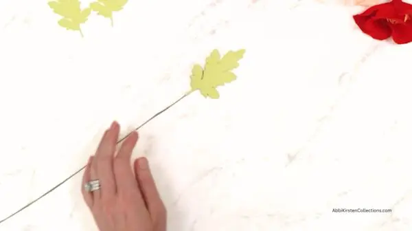 adding leaves to the wire stem