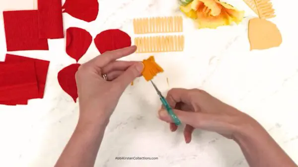 cutting a fringe for poppy flower center
