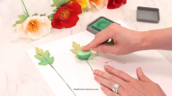 adding distress ink to leaves