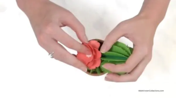 adding pink flower to cactus