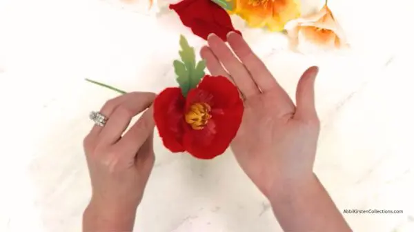 completed poppy flower in hand