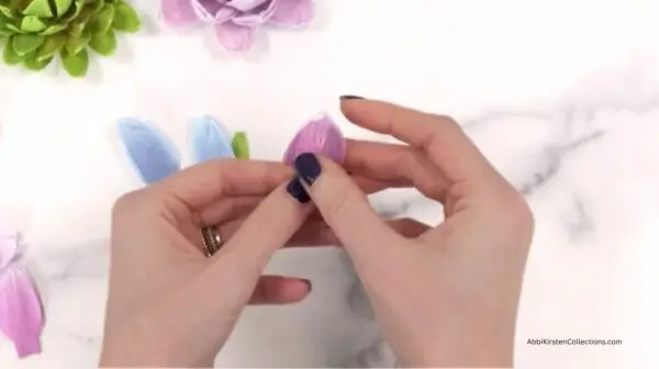 stretching the purple crepe paper petal