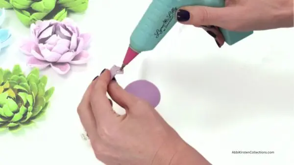 applying glue to the petals