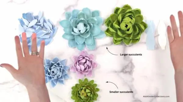 several sizes and colors of crepe paper succulent plants