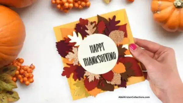 Thanksgiving card with autumn leaves and Happy Thanksgiving text