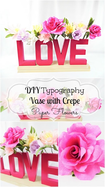 A collage of images shows a typography vase that spells out the word “LOVE.” The DIY cardboard letter vase is filled with paper flowers. The text in the center of the image reads, "DIY Typography Vase with Crepe Paper Flowers” in a script font.