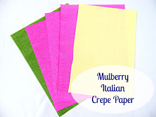 Green, yellow, and pink sheets of standard Italian crepe paper on a white background is available from Mulberry Paper. 