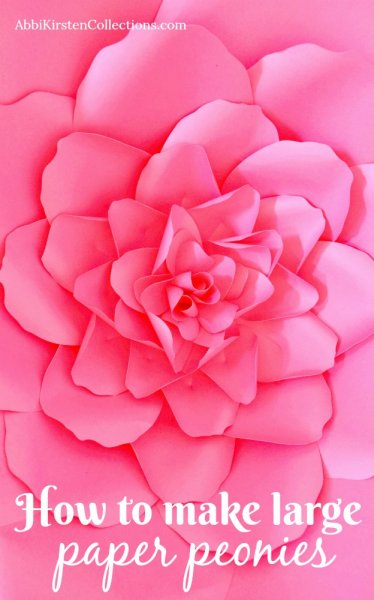 A large pink paper peony fills the photo with blooming paper leaves. The text at the bottom says, "How to make large paper peonies."