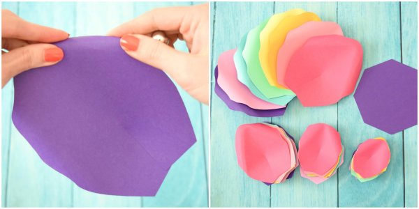 These two side-by-side photos show a close-up of Abbi Kirsten curling a large purple paper petal and a stack of rainbow petals already curled. These petals will be part of the Large rainbow flowers for the unicorn. 