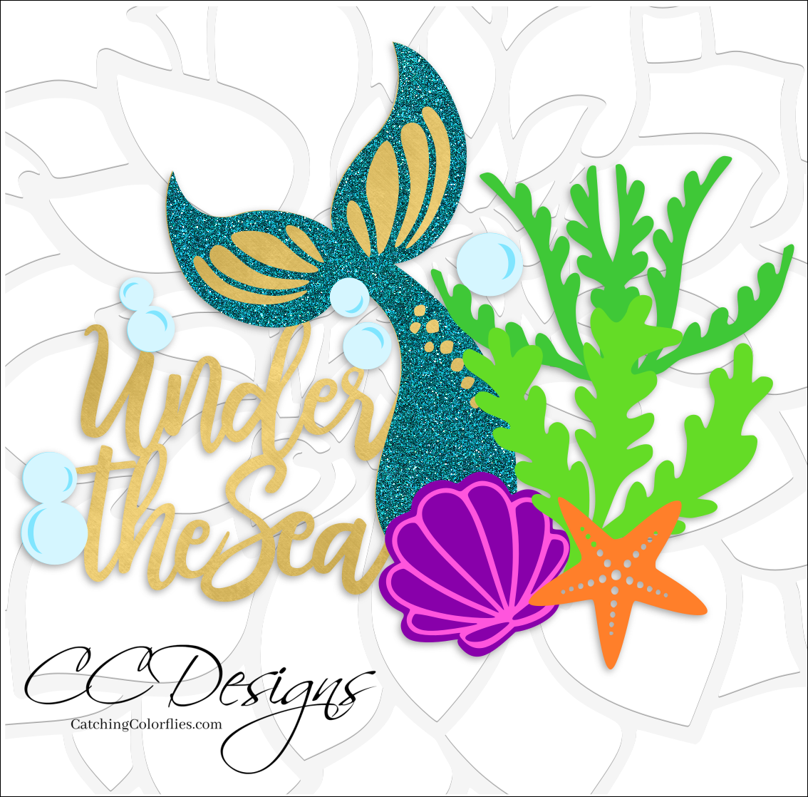 The two-layered Cricut "Under the Sea" cake topper with a mermaid tail and sea elements lays on a white background. CC Designs logo is in the lower left corner. 