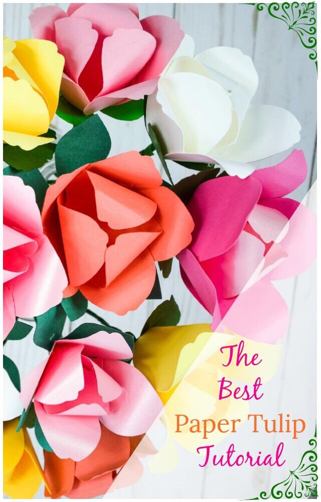 A bouquet of colorful paper tulips made from pink, coral, white, and yellow colored paper. Text on the image says "the best paper tulip tutorial"