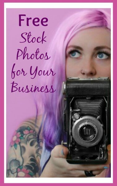 A women with tattoos, pink hair and blue eyes holding a vintage-looking black camera. There is purple image text overlay that reads "free stock photos for your business". 