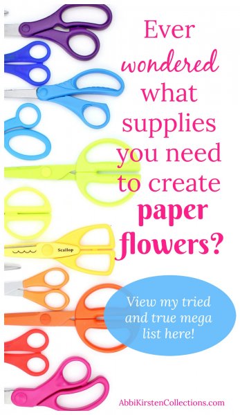 A rainbow of scissor handles line the left side of the picture. Pink text on the right side reads "Ever wondered what supplies you need to create paper flowers?" In an oval bubble are the words "View my tried and true mega list here!"