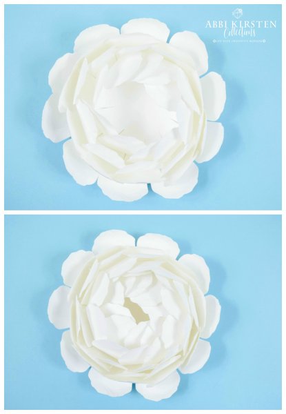White giant paper peonies, in two different stage of assembly, are placed one above the other. The bottom image is the layers of cupped centers ready to be placed in the middle of the bottom petal layers. 
