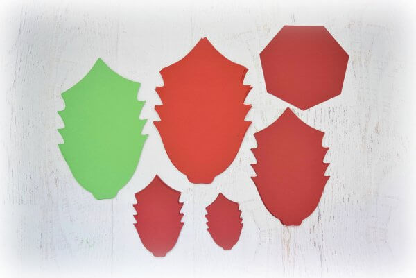 Cut outs of all the leaves you need to make Noel Poinsettia flowers, in red and green cardstock.