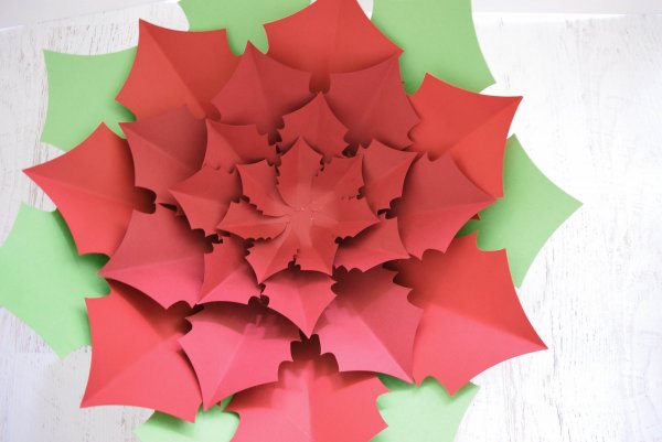 A final fourth layer of small poinsettia petals has been added to the center of the flower, creating a full Noel Poinsettia flower.