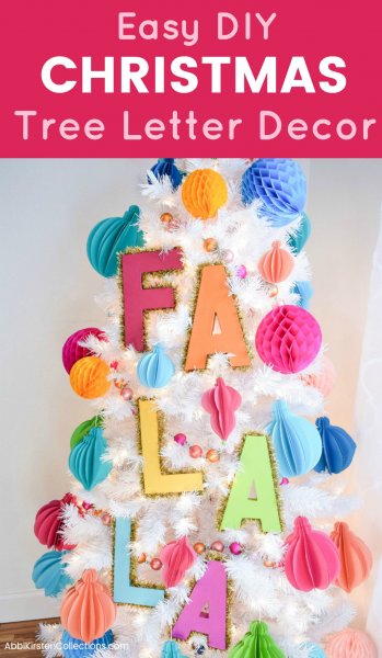 "Easy DIY Christmas Tree Letter Decor" is written above a picture of a faux white Christmas tree, decorated with bright pastel paper ornaments and large letter trimmed in tinsel that spell out "Fa La La."