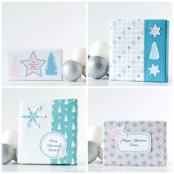 Four pictures make a square collage of different custom-printed gift wrap paper for Christmas. The wrapping paper is white with light blue and pink details like stars or Christmas trees. 