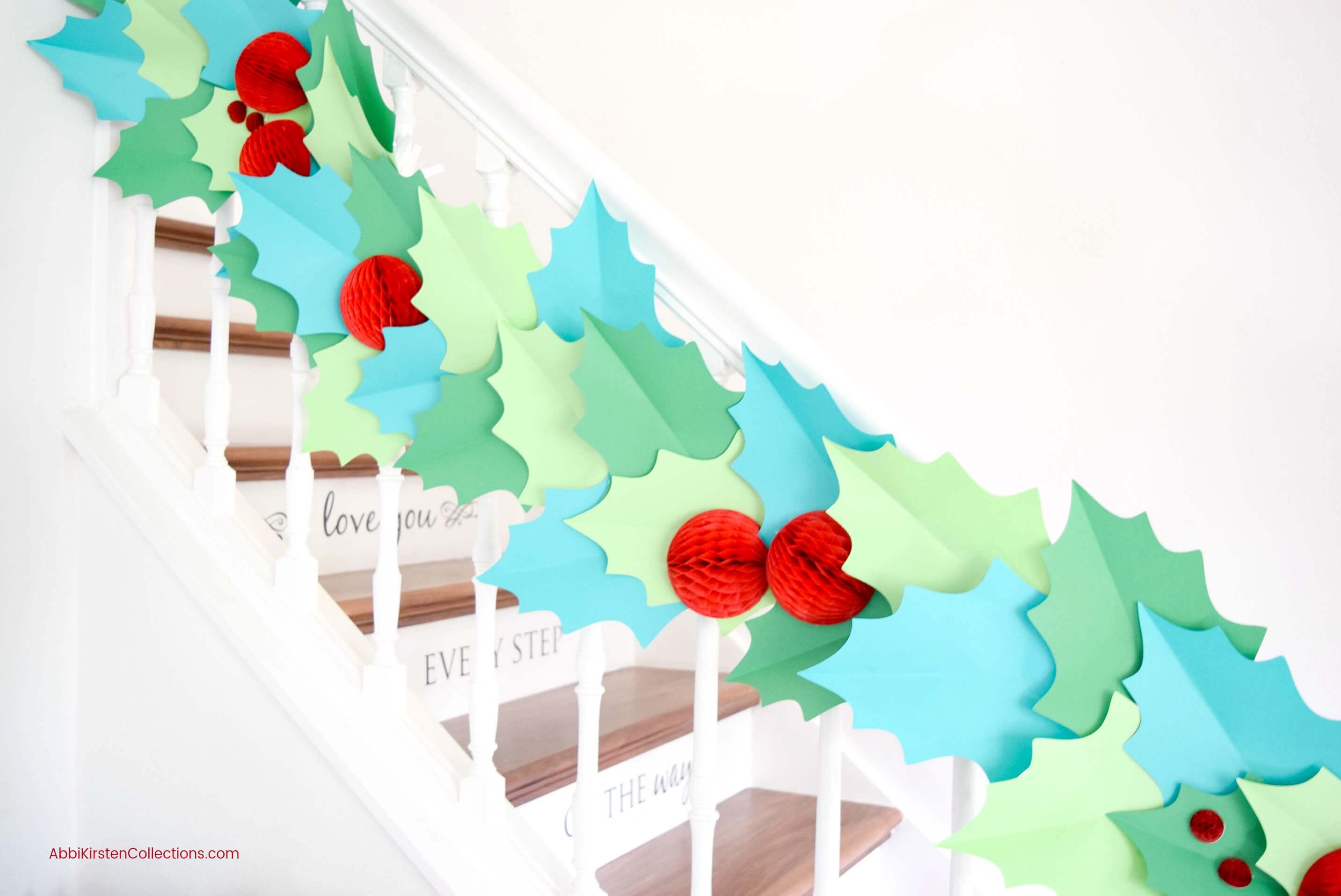 DIY Christmas Garland - How to Make Giant Paper Holly Garland to deck your halls and walls for the Holidays. Download your free holly template!