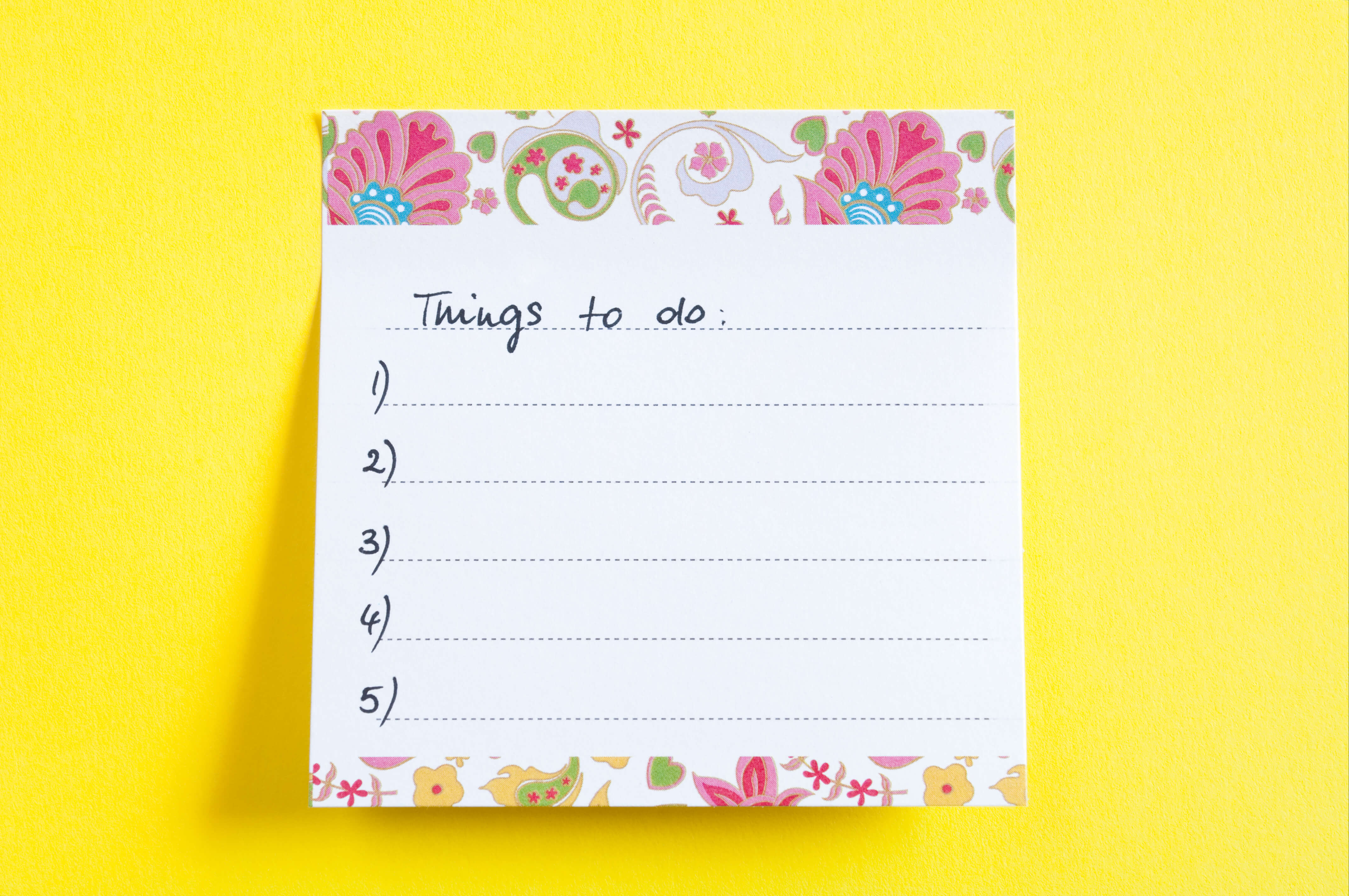 A small post-it note with a paisley floral border is stuck to a yellow background. The words "things to do" are written across the top, with a numbered list of 1 through 5 on each line.