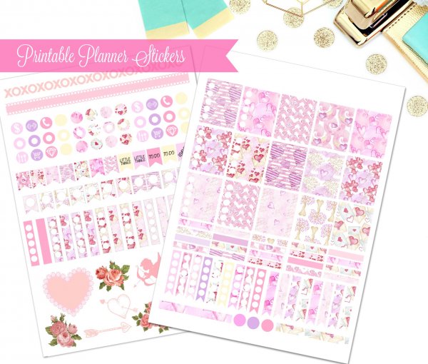 A pink banner with white text says "Printable Planner Stickers" over two sheets of February stickers. Gold and teal confetti, a stapler, and tags add decoration to the picture. 