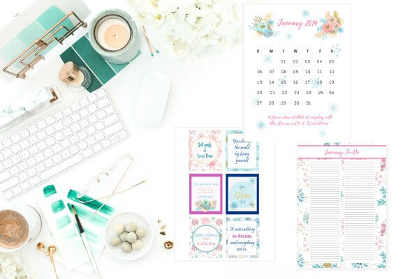 Three sheets of pastel winter floral planner stickers next to an image of a white desk with white, gold and green accented supplies.  
