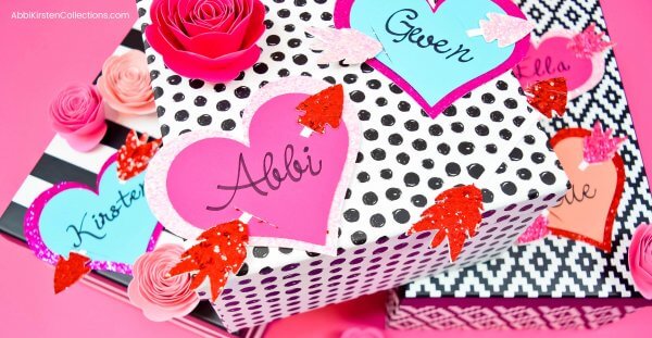 Personalized Valentine's Gift Tags attached to black and white graphic gift boxes. 