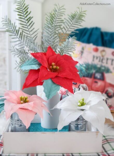 DIY Poinsettia Paper Flower Tutorial: Create Christmas and Holiday decor with this free poinsettia template and step by step tutorial. 