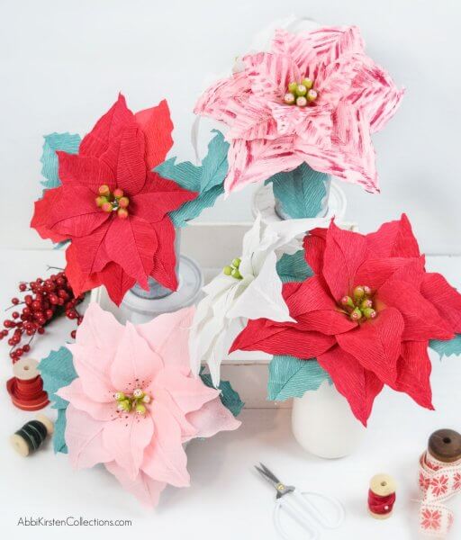 Crepe Paper Poinsettia Flower Tutorial: Create Christmas and Holiday decor with this free poinsettia template and step by step tutorial. 