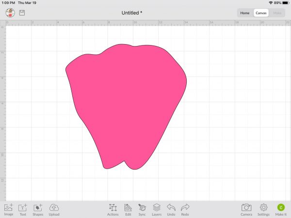 The once empty Cricut Design Space canvas now has a large pink petal template in it, having been uploaded and inserted from a zipped file.