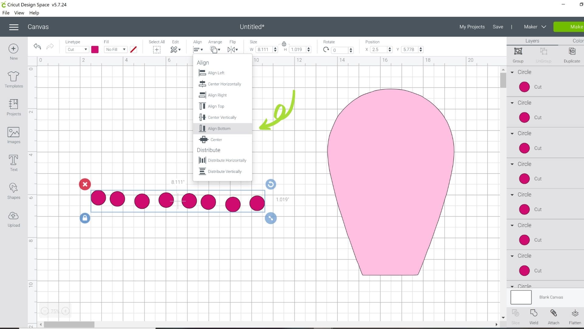 A screenshot of the Design Space canvas with small pink polka dots, a light pink flower petal. A drop-down menu has the "align bottom" option selected, with a small arrow pointing at the selection.
