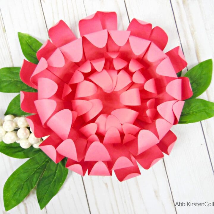 A large pink paper Chrysanthemum flower.