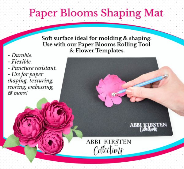 An advertisement for Paper Blooms Shaping Mat from Abbi Kirsten Collections. Abbi's hand uses shaping tool to curl pink paper petals. Red blooming red flowers adorn the left lower corner. The set is described as "durable, flexible, puncture resistant, use for paper shaping, scoring, embossing, and more!"