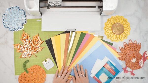 To make your Layered Paper Mandala Crafts, you need crafting paper, your Cricut maker, and Mandala SVG files.