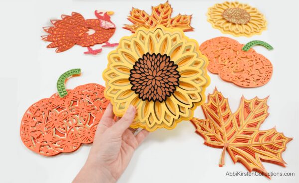 Learn how to make this stunning Paper Mandala Craft using your Cricut maker and a sunflower mandala SVG. 