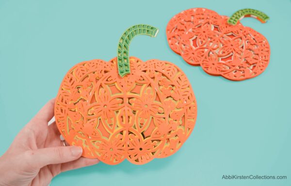 Using your Cricut maker, you can make just about any Paper Mandala Craft, including these adorable layered paper pumpkins.