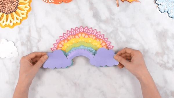 A demonstration of how to add the grey-blue cloud background to the completed 3D rainbow mandala.