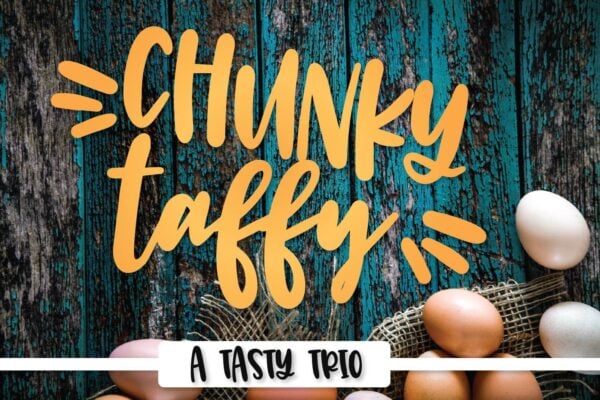 Chunky taffy written in yellow on a teal and brown wooden table with eggs in the corner. 