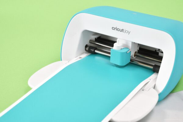 Cricut Joy machine with blue vinyl