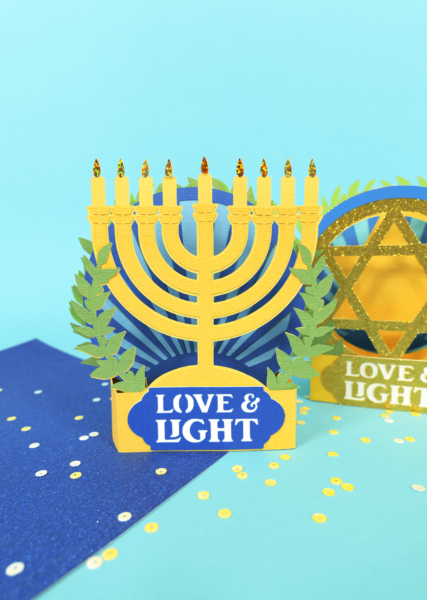 Pop up Hanukkah Menorah card made from blue, green and yellow cardstock. 