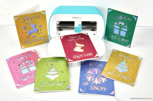 Learn how to make Christmas cards with your Cricut machine. Featuring the Cricut Joy machine use the card mat to make quick easy Christmas cards.