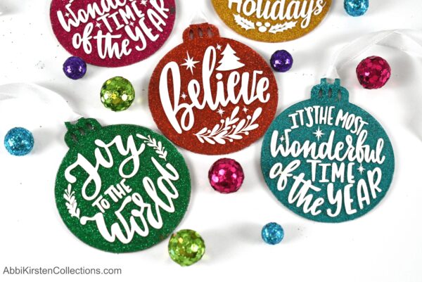 Create DIY glitter ornaments or DIY painted ornaments with clear acrylic disks for a special handmade Christmas decoration! Download free ornament templates here.