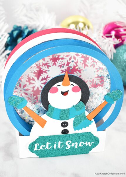 Let it snow snowman card made with Cricut. 