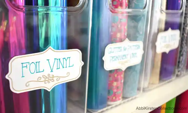 If your Cricut vinyl supplies grow too large for a drawer, try using these clear bins on a bookshelf. Don’t forget to use your Cricut cutting machine to make bin labels.