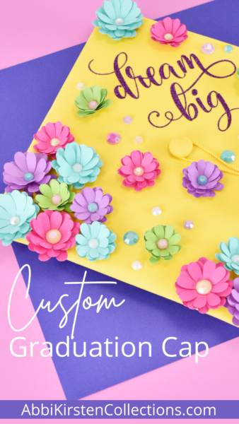 Personalize and decorate a graduation cap with heat transfer vinyl and small paper flowers. Full step-by-step tutorial plus templates!