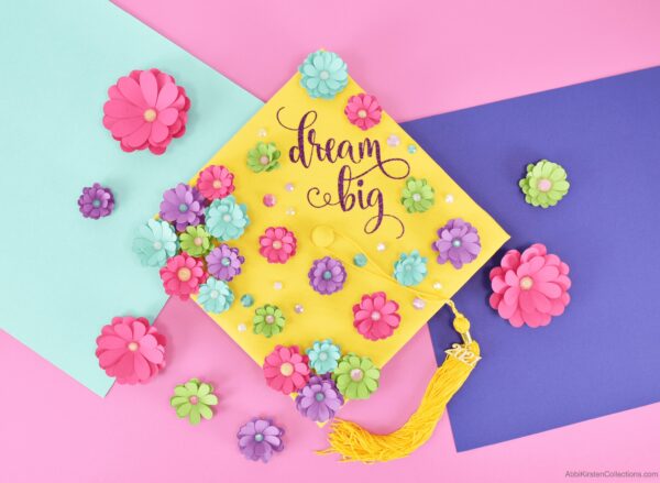 Dream big graduation cap with paper flowers in rainbow colors. heat transfer vinyl on graduation cap.