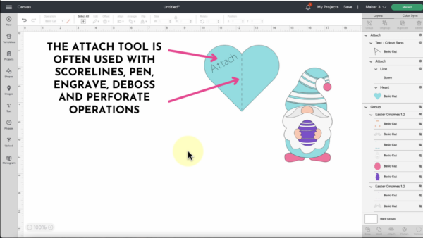 The blue gnome design will be attached to the blue heart. The instructional text for the attach tool says, "The attach tool is often used with scorelines, pen, engrave, deboss and perforate operations."